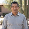 Portrait of James, 58, smiling in his sunny Mesa, Arizona backyard